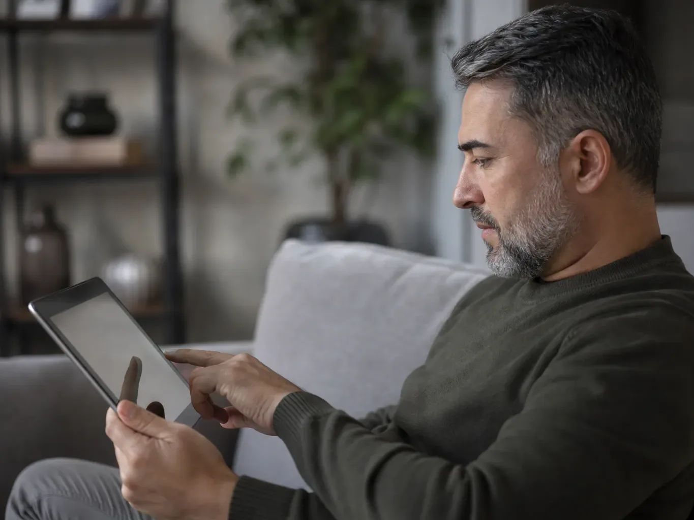A person reviewing a personalised interest rate quote displayed on a tablet screen